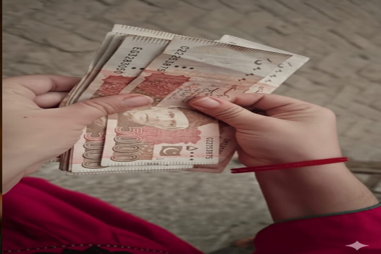 Pakistani woman holding cash received under Benazir Income Support Programme 8171
